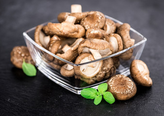 Portion of Raw Shiitake mushrooms on a slate slab