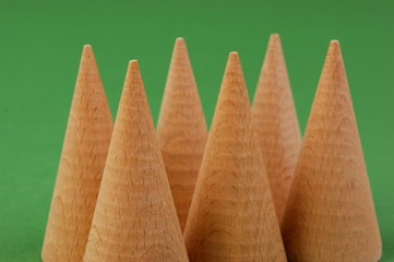 wooden geometric shapes on a green background