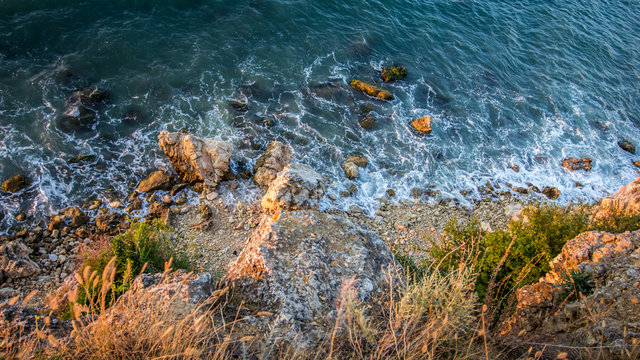 Rocks and sea. Dramatic scene. Composition of nature.