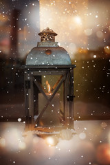 Burning lantern in winter at christmas time