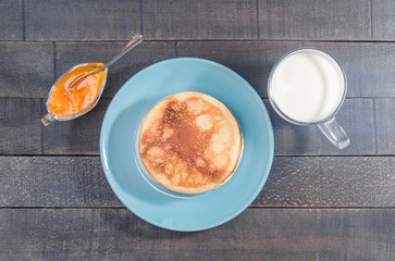 Small pancakes on a blue plate
