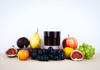 Grape juice with autumn seasonal fruits.
