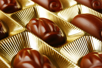 chocolate candies in a gold gift box