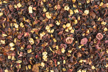 background of  herbal fruit tea with petals, dry berries and fruits