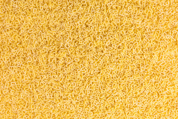 background of raw pasta in the form of letters and numbers