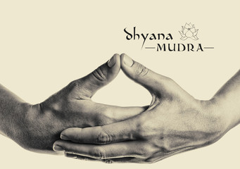 Dhyana mudra. Yogic hand gesture. Isolated on toned background black and white.