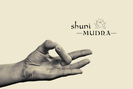 Shuni mudra. Yogic hand gesture. Isolated on toned background black and white.