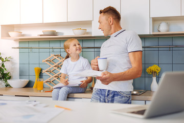 Smart friendly man talking to his daughter