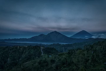 Foto op Aluminium Silhouette of the mountain volcano Batur on background night sky with stars © glass_frog