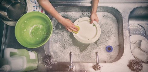 Overhead view of washing a plate