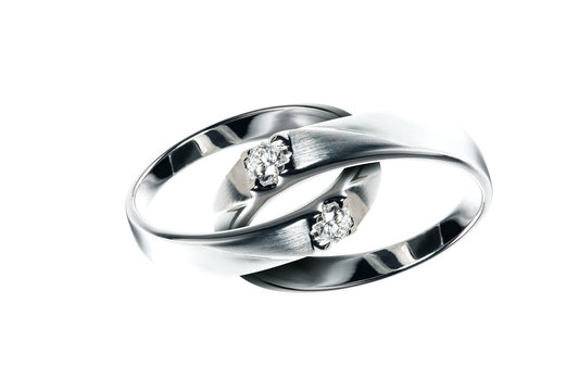 Two Platinum wedding rings with diamond hook together , Isolate on white with Path