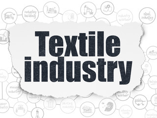 Manufacuring concept: Textile Industry on Torn Paper background