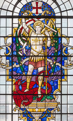 LONDON, GREAT BRITAIN - SEPTEMBER 14, 2017: St. Michael the archangel on the stained glass in church St. Lawrence Jewry by Christopher Webb (half of 20. cent.)