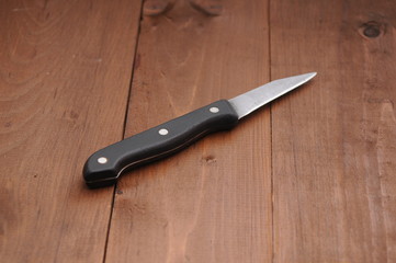 a knife on a wooden table