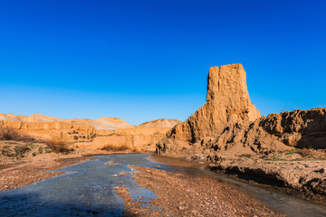Mountain river with yellow water
