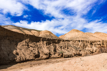 Mountain river with yellow water