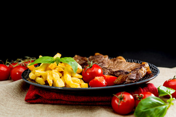 juicy steak beef meat with tomato and french fries