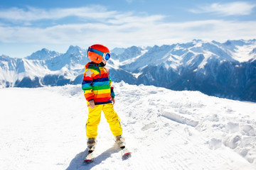 Fototapeta na wymiar Kids winter snow sport. Children ski. Family skiing.