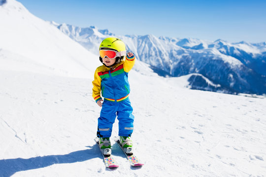 Kids winter snow sport. Children ski. Family skiing.