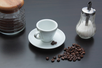 pile of coffee beans and a cup