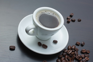 pile of coffee beans and a cup