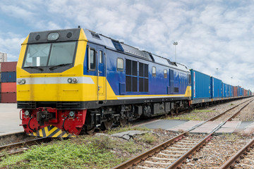 Fototapeta premium Cargo train platform with freight train container at depot in port use for export logistics background.
