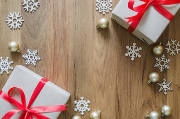 Fototapeta premium Christmas holidays background. Christmas decorations and gift boxes on wooden table.