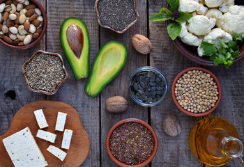 Composition of vegetarian products containing unsaturated fatty acids Omega 3 - nuts, hemp, chia, flax, avocado, soybeans, cauliflower, pumpkin seeds, tofu, dill, vegetable oil. Top view. Healthy food