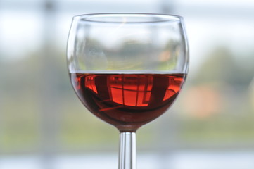 a glass of delicious red wine at a party