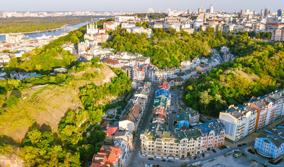 Aerial top view of Saint Andrew's church and Andreevska street from above, cityscape of Podol...