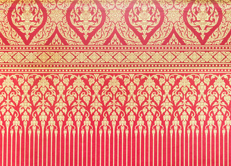Traditional Thai pattern on the red wallpaper.