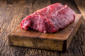 Beef Steak. Raw beef steak. Big Rib Eye steak on wooden board