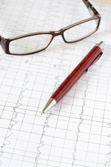 Electrocardiogram graph (ECG), heart analysis. Ballpoint pen