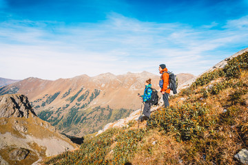 Couple of tourists in the mountains.