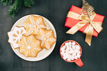 christmas gift and hot chocolate with cookies