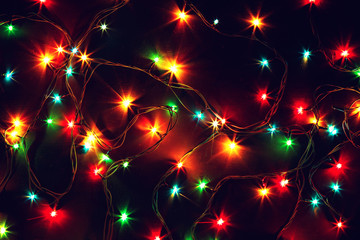 Colorful Christmas lights on a black background.