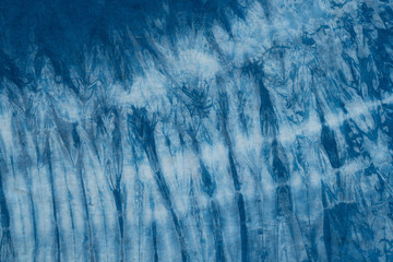 Pattern of blue tie batik dye on cotton cloth, Dyed indigo fabric background and textured, Painted...