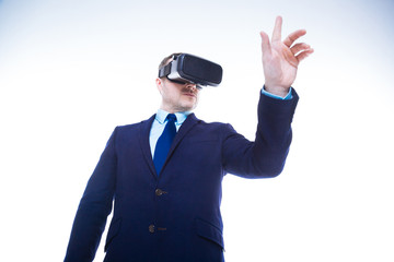 Confident nice businessman standing against white background