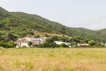 Fototapeta na wymiar House, mountain and vegetation in Carrapateira