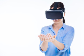 Delighted nice woman holding her hands in front of her