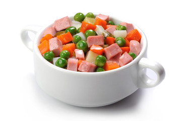 vegetables salad with boiled sausages on white background
