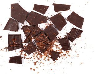 chocolate bars, pieces with shavings isolated on white background, top view