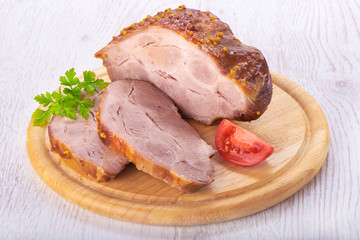 Pork stew on wooden plate on white background