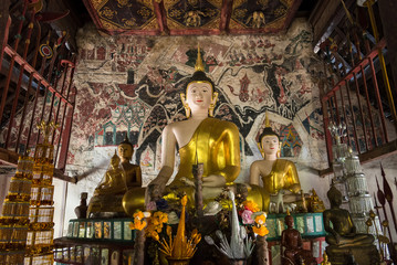Fototapeta premium Golden buddha statue in church in Rongngae temple at Nan Province, ThailandThailand.