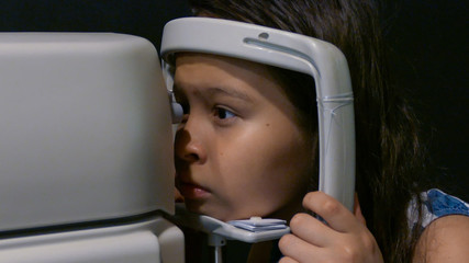Girl getting eyes tested