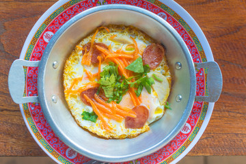 Pan - fried egg with toppings delicious breakfast in Thailand style