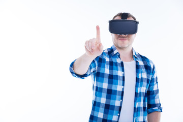 Handsome positive man being in a virtual reality
