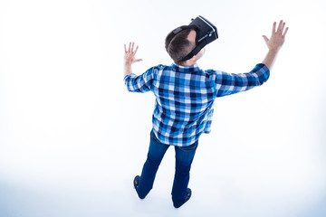 Nice adult man pressing hands to a sensory screen