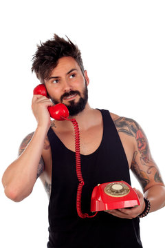 Attractive guy with a old red phone