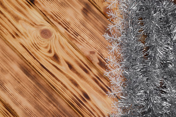 Christmas rustic background - planked wood with tinsel and free text space